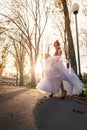 An young girl on a high heels in an autumn park, with a saxophone in her hands Royalty Free Stock Photo