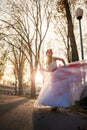 A young girl on a high heels in a wedding dress, with saxophone Royalty Free Stock Photo