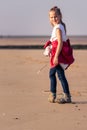 Young girl hiking on the beach