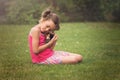 Young girl hold guinea pig pet in her arms. Child and animal concept Royalty Free Stock Photo