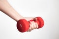 Strength and Determination: Young Girl Holding Red Dumbbell Royalty Free Stock Photo