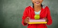 Young girl holding apple and books Royalty Free Stock Photo