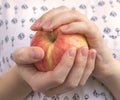 Young girl holding an apple in hands, closeup, healthy food concept photo Royalty Free Stock Photo