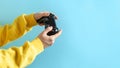 Young girl holding black joystick in her hands