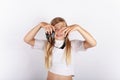 Young girl holding black slime in front of her face Royalty Free Stock Photo