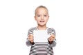 Young girl holding blank card infront of her. Speech therapy concept on white background. Correct pronounciation and articulation. Royalty Free Stock Photo