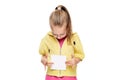 Young girl holding blank card infront of her. Speech therapy concept on white background.