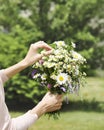 A young girl holding a bouquet of wildflowers in hands Royalty Free Stock Photo