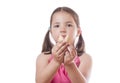 Young girl holding a closed fortune cookie