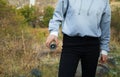 Young girl holding a compass in her hand. He is in the high mountains Royalty Free Stock Photo