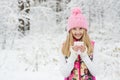 A young girl holding a cup of hot drink and smiling Royalty Free Stock Photo