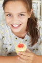 Young girl holding cupcake Royalty Free Stock Photo