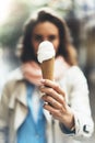 Young girl holding in female hands cone sweet icecream, tasty frozen summer dessert, hipster woman eating white ice cream close up Royalty Free Stock Photo