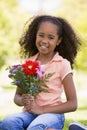 Young girl holding flowers