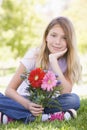 Young girl holding flowers