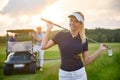 Young girl holding her golf club Royalty Free Stock Photo