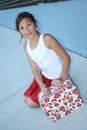 Young girl holding luggage