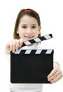 Young girl holding a movie clapper
