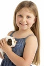 Young Girl Holding Pet Guinea Pig Royalty Free Stock Photo