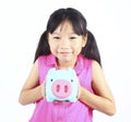 Young girl holding piggy bank Royalty Free Stock Photo