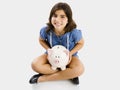 Young girl holding a piggybank Royalty Free Stock Photo