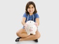 Young girl holding a piggybank Royalty Free Stock Photo