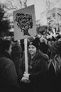 Young girl holding poster during protests