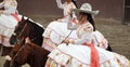 Female rider salutes