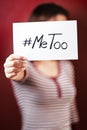 Young girl holding a sign supporting the metoo campaign