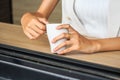 Young girl holding tea cup in hands. Royalty Free Stock Photo