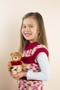 Young Girl Holding Teddy Bear with Toy Heart Royalty Free Stock Photo