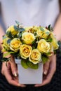 Young girl, holding vase with fresh spring flowers Royalty Free Stock Photo