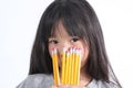 Young girl holding yellow pencils Royalty Free Stock Photo