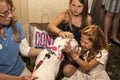 Young girl holds dog from pet rescue