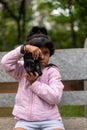 Little Girl Taking Pictures with DSLR Camera Royalty Free Stock Photo