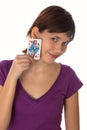 Young girl holds a playing card Royalty Free Stock Photo