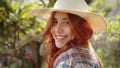 Young girl horse rider smiles on her ranch