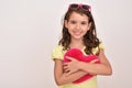Young girl hugging plush red heart Royalty Free Stock Photo