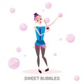 Young girl inflates soapy pink bubbles Royalty Free Stock Photo