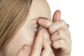 A young girl inserts contact lenses Royalty Free Stock Photo