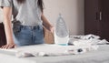 Young girl ironing shirt in home Royalty Free Stock Photo