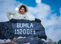 Young girl isolated at bumla pass india china border milestone board Royalty Free Stock Photo