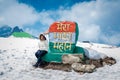 Young girl isolated at indian tricolor milestone board Royalty Free Stock Photo