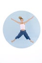 Young girl jumping with arms out smiling Royalty Free Stock Photo