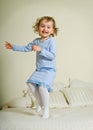 Young girl jumping on bed Royalty Free Stock Photo