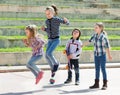 Young girl jumping while jump rope game Royalty Free Stock Photo