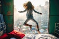 a young girl jumping on the top of her bed Royalty Free Stock Photo