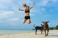 The young girl jumps on the beach of the island Samui. Royalty Free Stock Photo