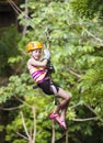 Young girl on a jungle zipline Royalty Free Stock Photo