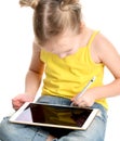 Young girl kid sitting reading learning drawing on digital tablet touch screen pad with pencil Royalty Free Stock Photo